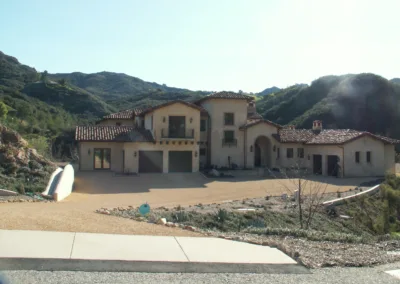 A large house on a hillside.