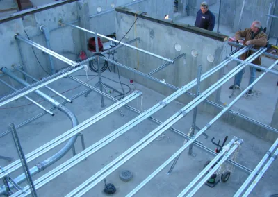 A man is standing on a concrete floor.